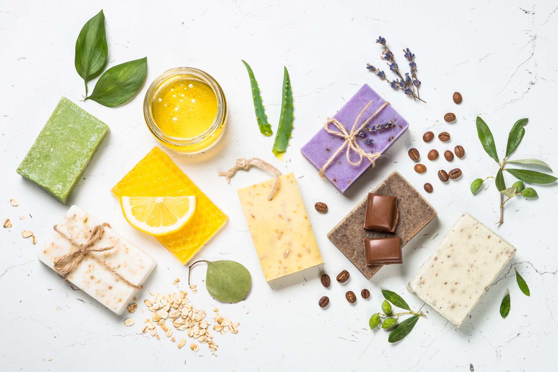 Natural soap bars on white top view.